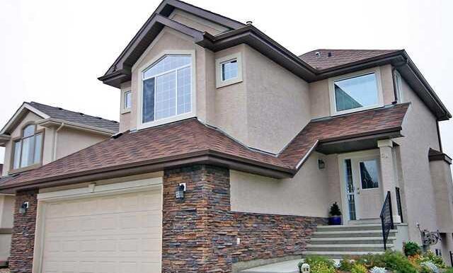 Exterior Front. Stucco and Stone Exterior